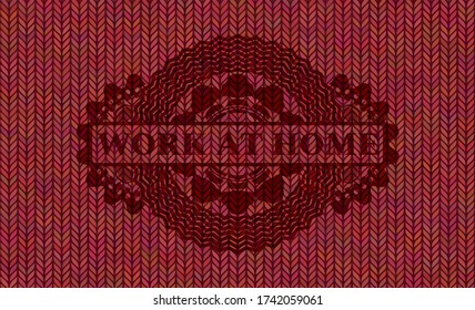 Work at Home text inside Red woolen fabric realistic badge. Cloth luxurious background. Artistic illustration. 