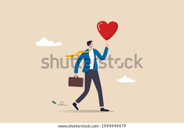 Work passion to motivate and inspire employee to\
achieve career success, love your job or happy and enjoy working\
dream job concept, happy businessman holding passionate heart shape\
walking to work.