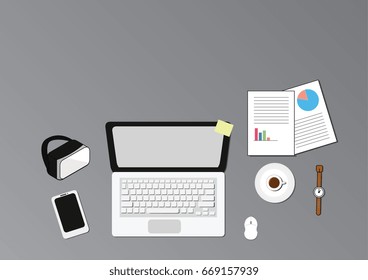 work space on table top view have laptop,mobile,coffee,watch,virtual reality and report