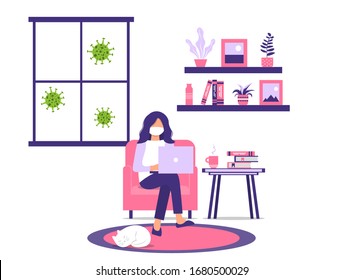 Work or study at home during an outbreak of the COVID-19 virus. People work at home to prevent a viral infection. Woman works on a laptop while sitting in a chair. Masked girl with laptop.