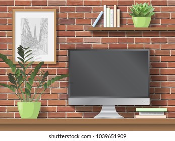 Work table, computer. Shelves with books and indoor plants on brick wall background. Workplace in the office or at home.