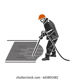 The worker compacts the concrete with a vibrator.