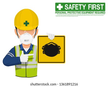 A worker with dust mask is presenting dust mask sign