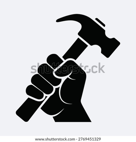 Worker hand holding hammer, tool of trade, labor movement, industry, construction, strength, empowerment.