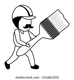 worker holding brush tool