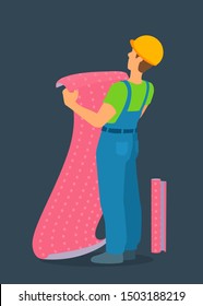 A worker holding a piece of wallpaper, going to stick them on the wall, looking up. A man in overalls and hard protective helmet stands with his back to the viewer. Vector cartoon illustration.
