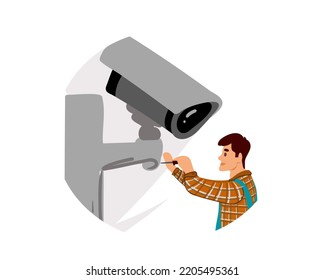  A worker installs a camera on the street CCTV Installation Wizard. Video surveillance master. CCTV camera installation service. Electrician with a screwdriver repairing a CCTV camera indoors.