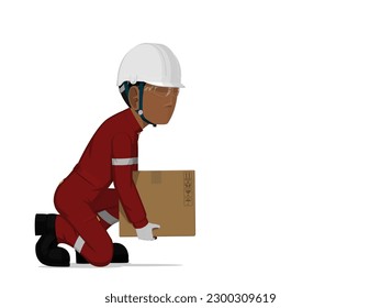 A worker is lifting a small box on the floor