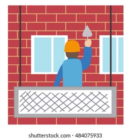 Worker is maintaining a house wall