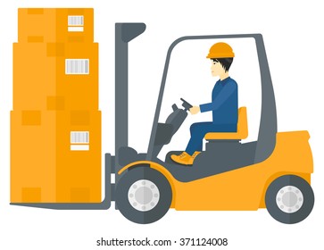 Worker moving load by forklift truck.