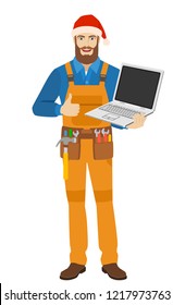 Worker in Santa hat with laptop notebook showing the thumb up. Full length portrait of worker in a flat style. Vector illustration.