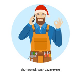 Worker in Santa hat talking on the mobile phone and shoing a okay hand sign. Portrait of worker in a flat style. Vector illustration.