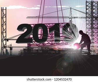 worker sets large numbers 2019 on the roof of the building under construction