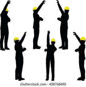 worker silhouette with yellow protective headgear isolated