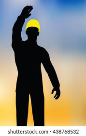 worker silhouette with yellow protective headgear isolated