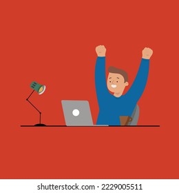 The worker sits at the table in front of the computer with the lamp turned on and rejoices at the finished work