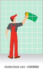 Worker washing a wall made of ceramic tiles