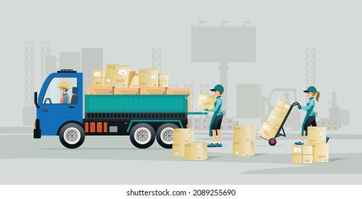 Los trabajadores están cargando cajas en un camión con fondo gris.