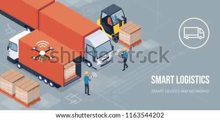 Workers loading products on the trucks and tracking delivery with a tablet: smart logistics and transportation concept