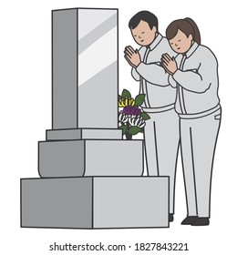 A workers visiting a grave stone.