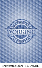 Working blue emblem or badge with geometric pattern background.