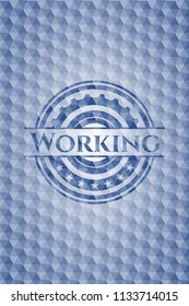Working blue hexagon badge.