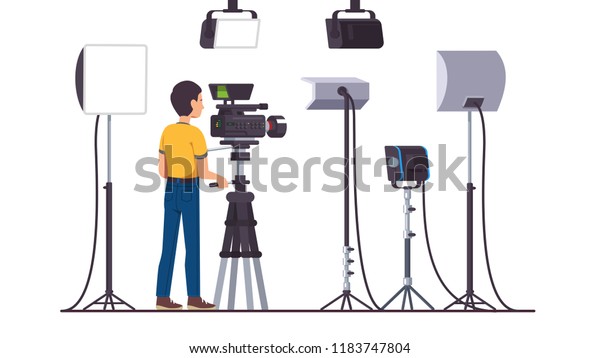 Working cameraman shooting with professional\
video camera on stand. Television productions studio with stage\
lighting equipment, softbox, LED, spot, continuous, flood lights.\
Flat vector\
illustration