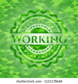 Working green emblem with triangle mosaic background