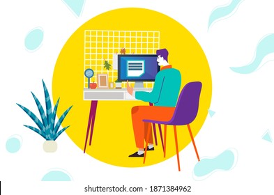 Working from home at a desk on a computer.