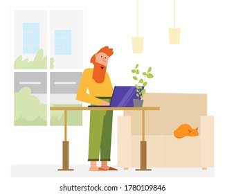 Working from home man using adjustable table. He has cozy apartment. While man working his cat sleeping on a couch.