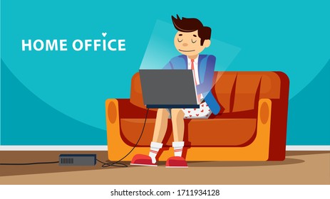 Working at home, home office, young man working on laptop and computer at home on a couch wearing underpants and suit. 