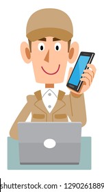 A working man wearing  beige work clothes to operate a computer while talking on mobile phone