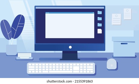 Working on the computer at the desk in the office.
