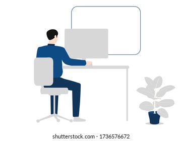 A working person is sitting at a computer cozy atmosphere flower on the floor .Business