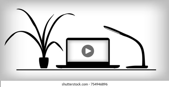 Working place with play icon on laptop