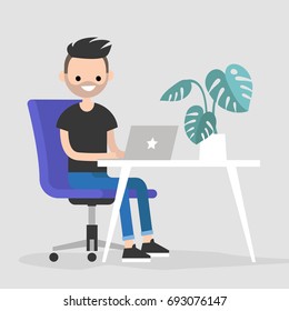 Working space. Young character typing on a laptop / flat editable vector illustration, clip art