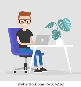 Working space. Young character typing on a laptop / flat editable vector illustration, clip art