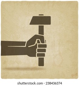 working symbol hand with hammer old background - vector illustration. eps 10