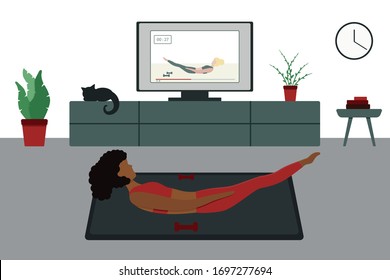 Workout At Home By Video. Online Training. The Ebony Girl Goes In For Sports At Home In Front Of The TV. Home Workout. Stay At Home. Isolation.