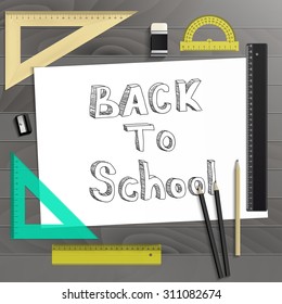 Workplace art board, paper, ruler, protractor, pencils, eraser and sharpener realistic plastic on a wooden background/Back to School