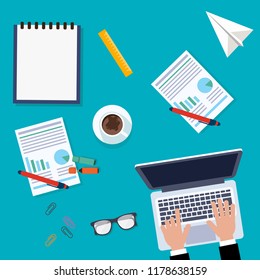 Workplace for business, management and IT. View from above. Laptop, mobile phone, notebook and office supplies on the desktop