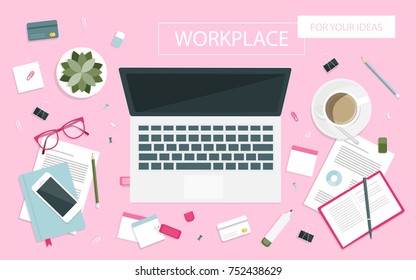 Workplace for business, management and IT. View from above. Laptop, mobile phone, notebook and office supplies on the desktop