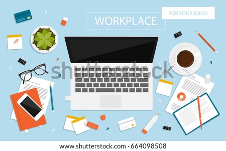 Workplace for business, management and IT. View from above. Laptop, mobile phone, notebook and office supplies on the desktop
