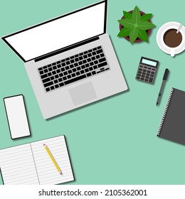 Lugar de trabajo para negocios con taza de café, portátil, smartphone y espacio para copiar portátiles sobre fondo de color verde. Vista superior. El estilo laico.