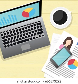 Workplace with coffee, a laptop, smartphone and documents