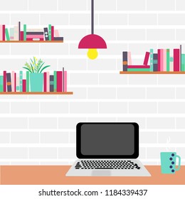 Workplace. Computer and bookshelves on a brick wall