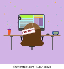 Workplace with a computer and a sign on the chair with the inscription vacancy