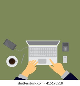 Workplace concept. Top view laptop, notebook, pencil, mobile phone, hands,green background
