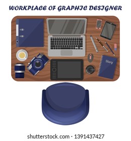 Workplace graphic designer. View from above. Photographer workspace. Isolated objects on white background. Graphic tablet, camera with lens, set of markers, laptop and other equipment on a table