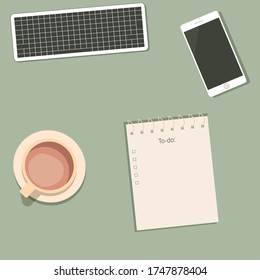 Workplace. Keyboard, mobile phone, notebook, coffee and office supplies on the table. Remote work concept.